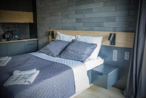Łóżko lub łóżka w pokoju w obiekcie Albus 312