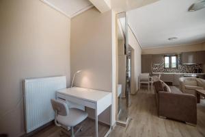 a room with a white desk and a living room at Athens, North Suburbs, Luxury Penthouse in Athens