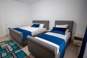 Postel nebo postele na pokoji v ubytování Simona Apartaments