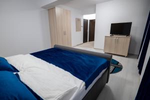 Postel nebo postele na pokoji v ubytování Simona Apartaments