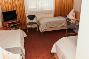 Ένα ή περισσότερα κρεβάτια σε δωμάτιο στο Motel Łasuch