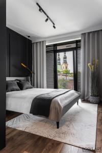 Postel nebo postele na pokoji v ubytování Stylowy apartament w centrum Poznania