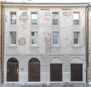 a facade of a building with two entrances at LEONI DI COLLALTO PALACE in Treviso