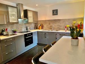 a kitchen with a table and chairs in it at Liverpool city centre apartment on Duke Street in Liverpool