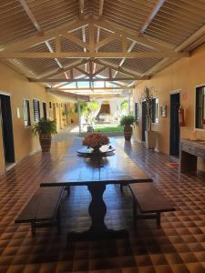 a room with a table in the middle of a building at Pousada Dois Rios in Barra do Garças