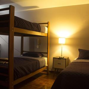Ένα ή περισσότερα κρεβάτια σε δωμάτιο στο Montreal Hostal