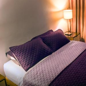 Ένα ή περισσότερα κρεβάτια σε δωμάτιο στο Montreal Hostal