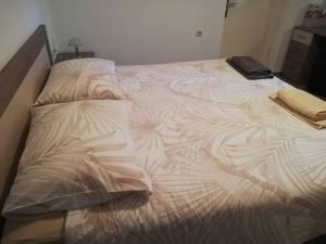 Postel nebo postele na pokoji v ubytování Apartments Sandra