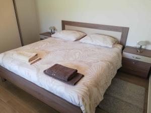 Postel nebo postele na pokoji v ubytování Apartments Sandra