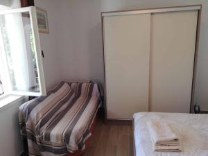 Postel nebo postele na pokoji v ubytování Apartments Sandra