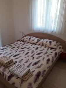 Postel nebo postele na pokoji v ubytování Apartments Sandra