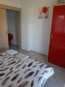 Postel nebo postele na pokoji v ubytování Apartments Sandra