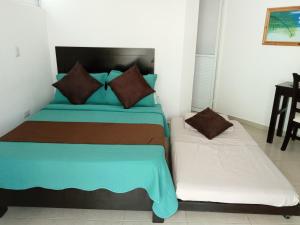 Postel nebo postele na pokoji v ubytování Hotel La Estrella Polar