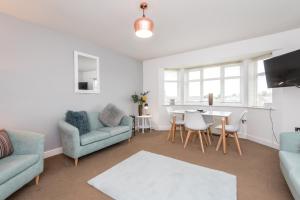 a living room with a couch and a table at New Durham Courtyard in Durham