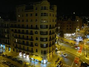 a city street filled with lots of tall buildings at Ally's Bed&Breakfast in Barcelona