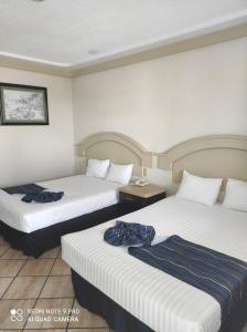 Tempat tidur dalam kamar di Hotel Playa Marina