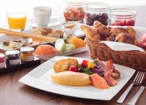 a table with a plate of food on a table at ANA InterContinental Tokyo by IHG in Tokyo