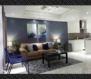 a living room with a couch and a table at The Condo (by Modern Apartments) in Rosarito