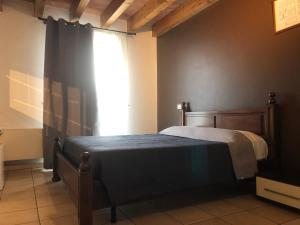 A bed or beds in a room at IL Borgo