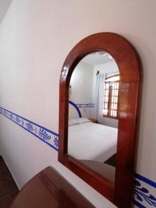 A bed or beds in a room at Don Luis Hostal - Sucursal Galeana - Tecolutla