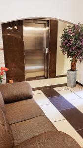 a living room with a couch and a refrigerator at Meson de Juan Valle in Guanajuato