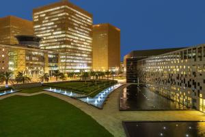 a view of a city at night with tall buildings at Crowne Plaza Riyadh - RDC Hotel & Convention, an IHG Hotel in Riyadh