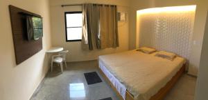 Postel nebo postele na pokoji v ubytování Porto Real Resorts Rogério + 52 fotografií