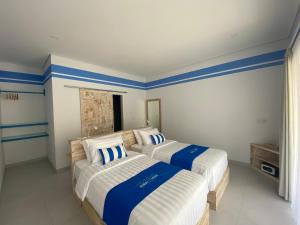 Postel nebo postele na pokoji v ubytování Kura Kura Divers Lodge + 23 fotografií
