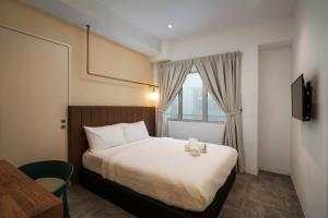 Masson Hotel Butterworth客房内的一张或多张床位