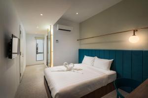 Masson Hotel Butterworth客房内的一张或多张床位