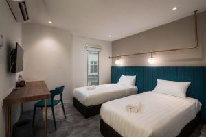Masson Hotel Butterworth客房内的一张或多张床位