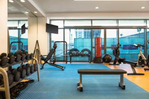 a gym with treadmills and exercise equipment in a building at Crowne Plaza Riyadh - RDC Hotel & Convention by IHG in Riyadh