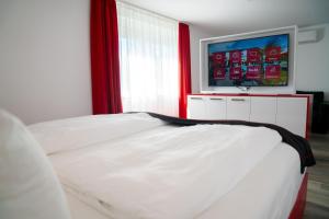 Ένα ή περισσότερα κρεβάτια σε δωμάτιο στο Hotel Andante Rust