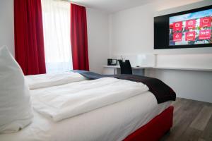 Ένα ή περισσότερα κρεβάτια σε δωμάτιο στο Hotel Andante Rust