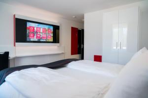 Ένα ή περισσότερα κρεβάτια σε δωμάτιο στο Hotel Andante Rust