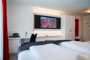Ένα ή περισσότερα κρεβάτια σε δωμάτιο στο Hotel Andante Rust