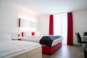 Ένα ή περισσότερα κρεβάτια σε δωμάτιο στο Hotel Andante Rust