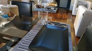 a table with a wine glass on top of it at B&B La Dimora Della Zarina in Mormanno