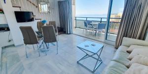 a living room with a couch and a table at Skol 708 Fantastic 2 Bedroom Apartment For Holiday Rentals in Marbella
