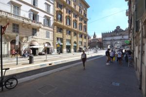 a group of people walking down a city street at Glamour Spanish Steps in Rome