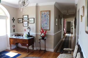 a living room with a painting on the wall at Adare Country House in Adare