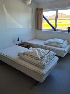 Ένα ή περισσότερα κρεβάτια σε δωμάτιο στο Stoholm Vandrehjem
