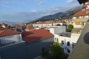 a view of a city with buildings and mountains at INN Korça, Center City Apartament in Korçë