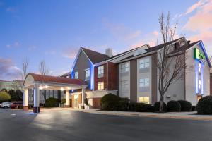 a rendering of a hotel with a parking lot at Holiday Inn Express Alpharetta - Roswell by IHG in Alpharetta