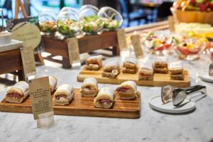 a display of sandwiches and other food on a table at Sir Anthony in Playa de las Americas