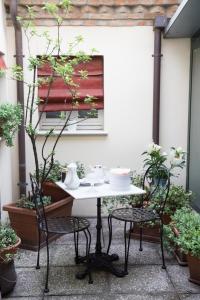 a table and two chairs on a patio at Il Bagattino in Ferrara