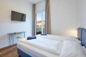 Voodi või voodid majutusasutuse Hotel Paradiso Conca d'Oro toas