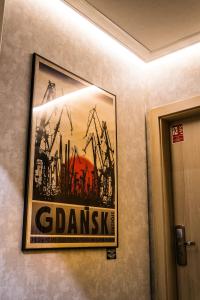 a picture of a painting on a wall at Stay inn Hotel Gdańsk in Gdańsk