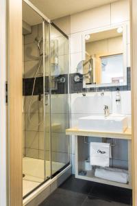 a bathroom with a sink and a shower at Stay inn Hotel Gdańsk in Gdańsk