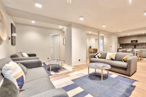 a living room with two couches and a kitchen at 121 - Urban Gorgeous Flat in Montorgueil in Paris